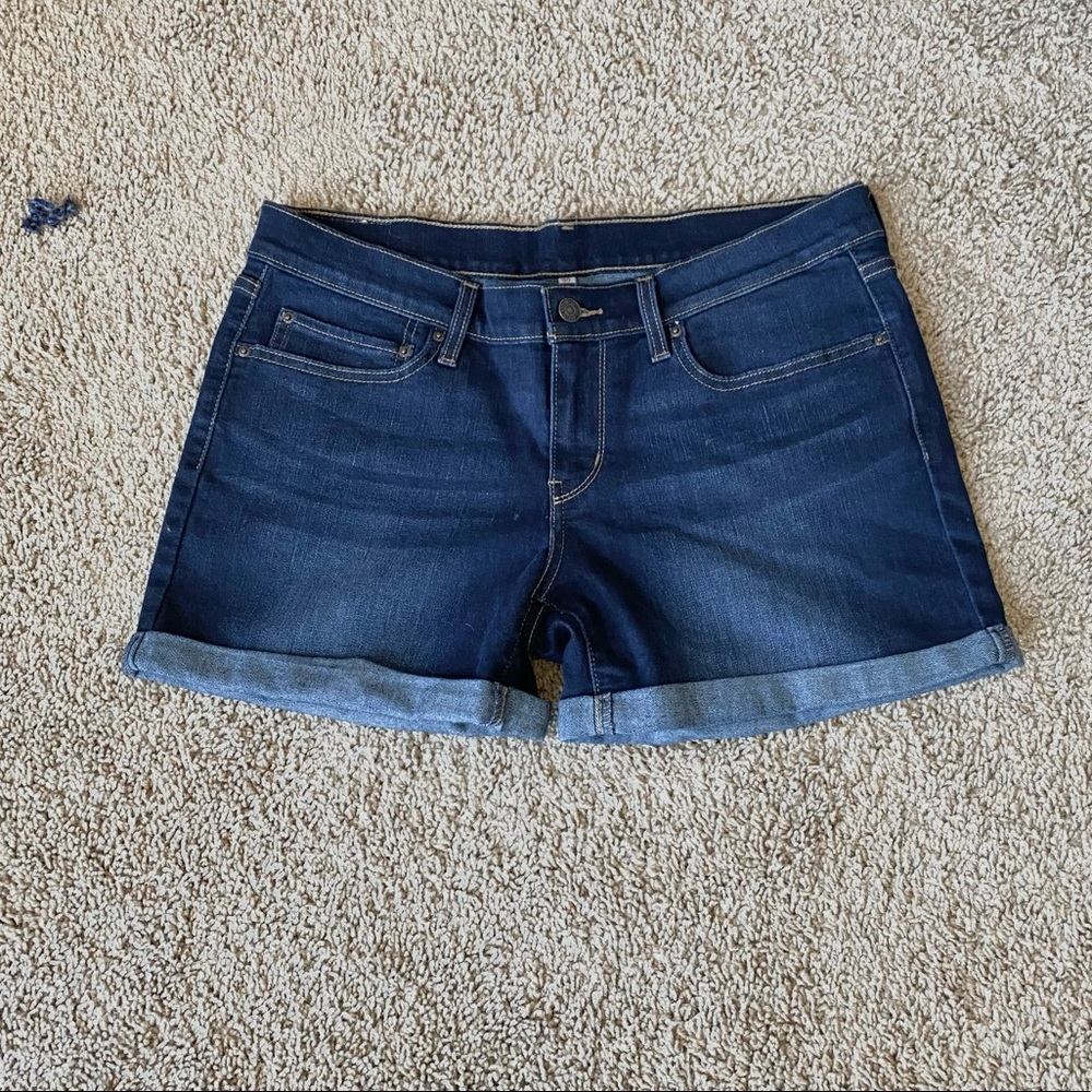 Levi Strauss & Co blue jean shorts.